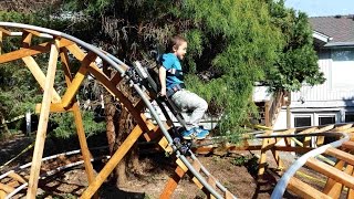 Rio on 3D-02 backyard roller coaster track, riding new 3D-07 cart