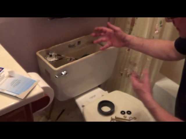 How To Fix a Leaking Toilet Tank - Toilet Tank Repair - Remove Rusted Toilet Bolts class=