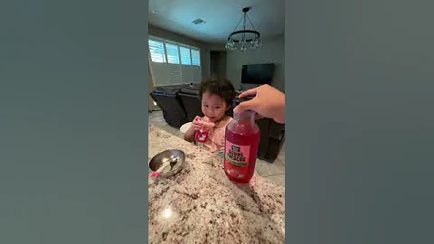 Yummy! Chloe enjoys drinking Minute Maid Aguas Frescas Strawberry juice.