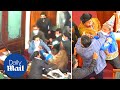 Crazy moment bolivian politicians fight in parliament before falling over