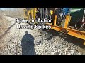 Driving spikes in new railroad ties with a nordco spiker