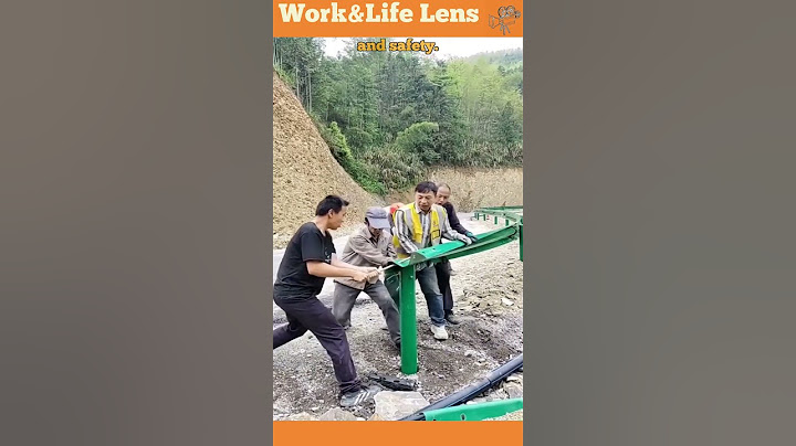 Workers using all their strength to install safety barriers on the motorway #construction
