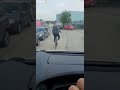 Angry biker crashes into car