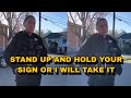 Lady Cop Tells Protester To Hold His Sign Or She’ll Take It