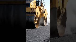The Road Maker: A heavy-duty steamroller smoothing out fresh, steaming asphalt on a new highway.