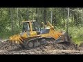 Komatsu D65E-12 pushing dirt