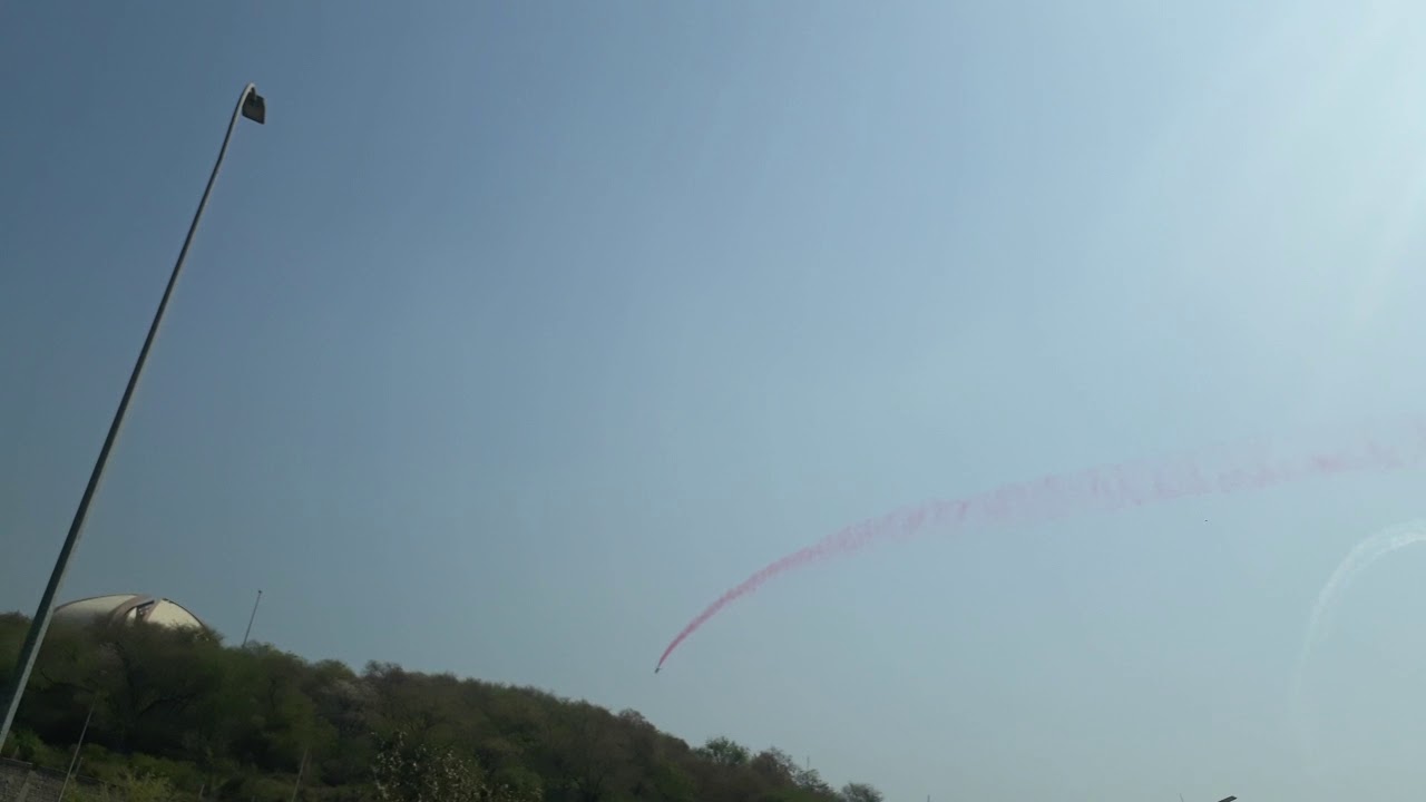 Pakistan Army Jets throwing rainbow colours at Parade Ground Islamabad