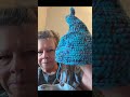 Crocheted witch hat with bold colors.