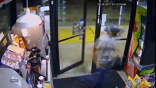 Surveillance video shows man in Miami Heat hat robbing gas station