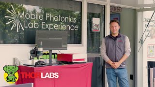 Intro to Photonics Experience | Thorlabs Mobile Photonics Lab
The Thorlabs Mobile Photonics Lab Experience offers students the opportunity to get hands-on experience with Photonics – the science of light! Guided by current Thorlabs employees, visitors can learn about key photonics concepts and equipment, gain insight into potential careers, and network with individuals that have years of experience working in the field.
In this video, Dr. Bill Warger, Director of Photonics Education at Thorlabs, provides a walkthrough presentation of the Mobile Photonics Lab, highlighting the Introduction to Photonics Experience, which is presented at every visit in the United States. In this Experience, three photonics applications are explored: Biomedical Optics and Imaging, Spectroscopy, and Optical Communications.
Biomedical Optics and Imaging: A noninvasive imaging technique, Optical Coherence Tomography (OCT) uses light to image subsurface features in real time. OCT allows visitors to image the layers of skin in their fingerprint, see where the nail is growing from, and view the layers of a cell phone display. The technology is typically used during routine eye exams to image the retina.
Spectroscopy: A spectrometer is a device that measures the color (or wavelength) of light. The measurement of light over many colors (or wavelengths) provides an optical spectrum. The interaction of light with a molecule (or chemical) can create unique optical spectra that can be used to identify their presence in the air. The technology is typically used for astronomy and greenhouse gas detection.
Optical Communications: Information can be transmitted with light by encoding the information on a laser beam that travels through the air and then hits a detector to create an electrical signal played on a speaker. However, any disturbance to the light can affect what is heard. Light can also be transmitted without interruption through optical fiber. A magnified image of optical fiber shows the structure of fiber, but a water stream demonstrates how light travels through optical fiber by total internal reflection. The technology is used to bring high-speed internet into our homes.
In addition to the Intro to Photonics Experience, visitors to the Mobile Photonics Lab can learn about careers in photonics, available photonics programs, and potential funding opportunities. Other hands-on experiences such as Quantum Optics, OCT Imaging, and Lab Basics Experiences are also available.
To find out more, please visit www.thorlabs.com/mobilelab/?&ytid=hZMAtfUTujk and follow our journey on social media!
Timeline:
0:00 Introduction to Photonics
0:56 Biomedical Optics and Imaging
2:56 Spectroscopy
6:24 Optical Communications
8:06 Optical Fiber
8:56 Water Tank Demo Intro to Photonics Experience | Thorlabs Mobile Photonics Lab