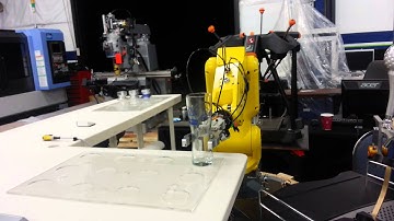 Fanuc Robot serving beer at CNC Machine service