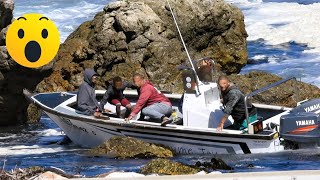 Boat ran on the rocks at the harbour entrance in Kleinmond