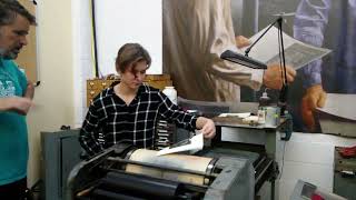 My daughter running the proof press at the International Printing Museum