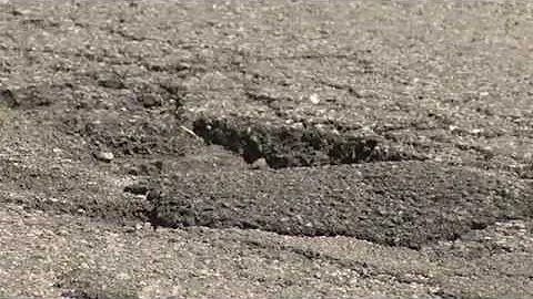Street repair crews work overtime to repair potholes