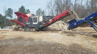 Sandvik QJ341+ crushing waste marble and granite countertops ... Edge TS65 stockpiling material