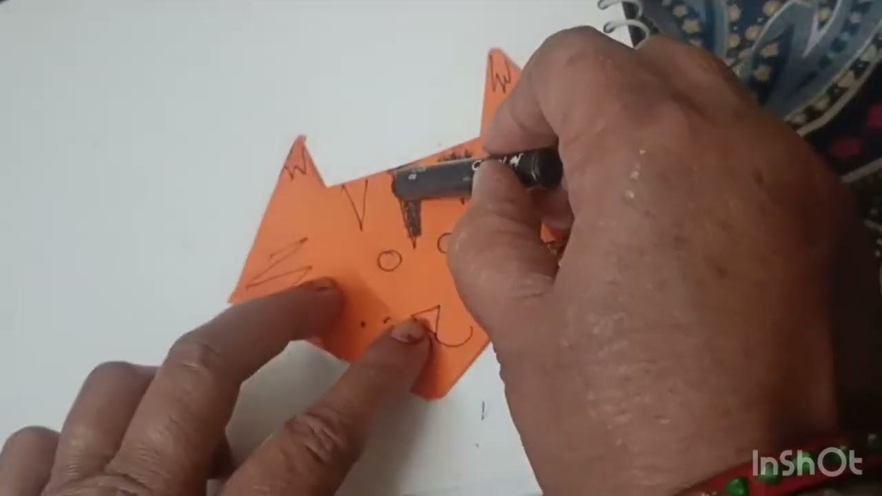 Making a cat face with glazed paper