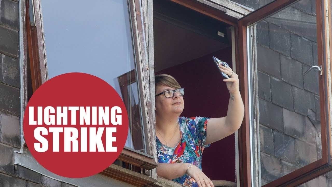 Women's phone was struck by a bolt of lightning as she tried to film a