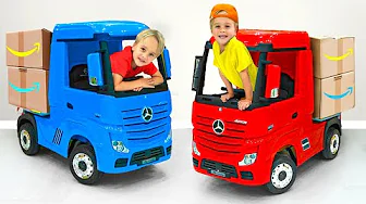 Chris climbs into a toy truck and plays delivery boy.
