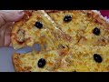 بيتزا بعجين رائع بدون دلك و حشوة لذيذة تتوجد في اقل من دقيقتين و الطعم يمي يمي 