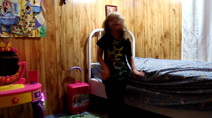Ashley Wakefield singing and dancing