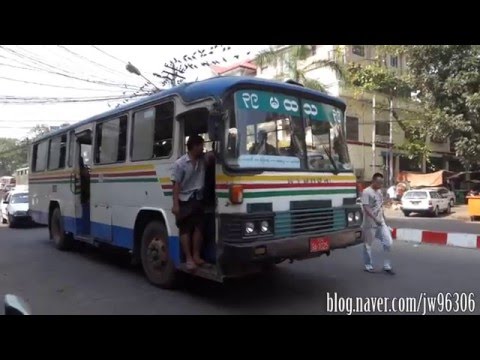 local-bus-riding-at-yangon,-myanmar-(1983'-hyundai-fb485-bus)