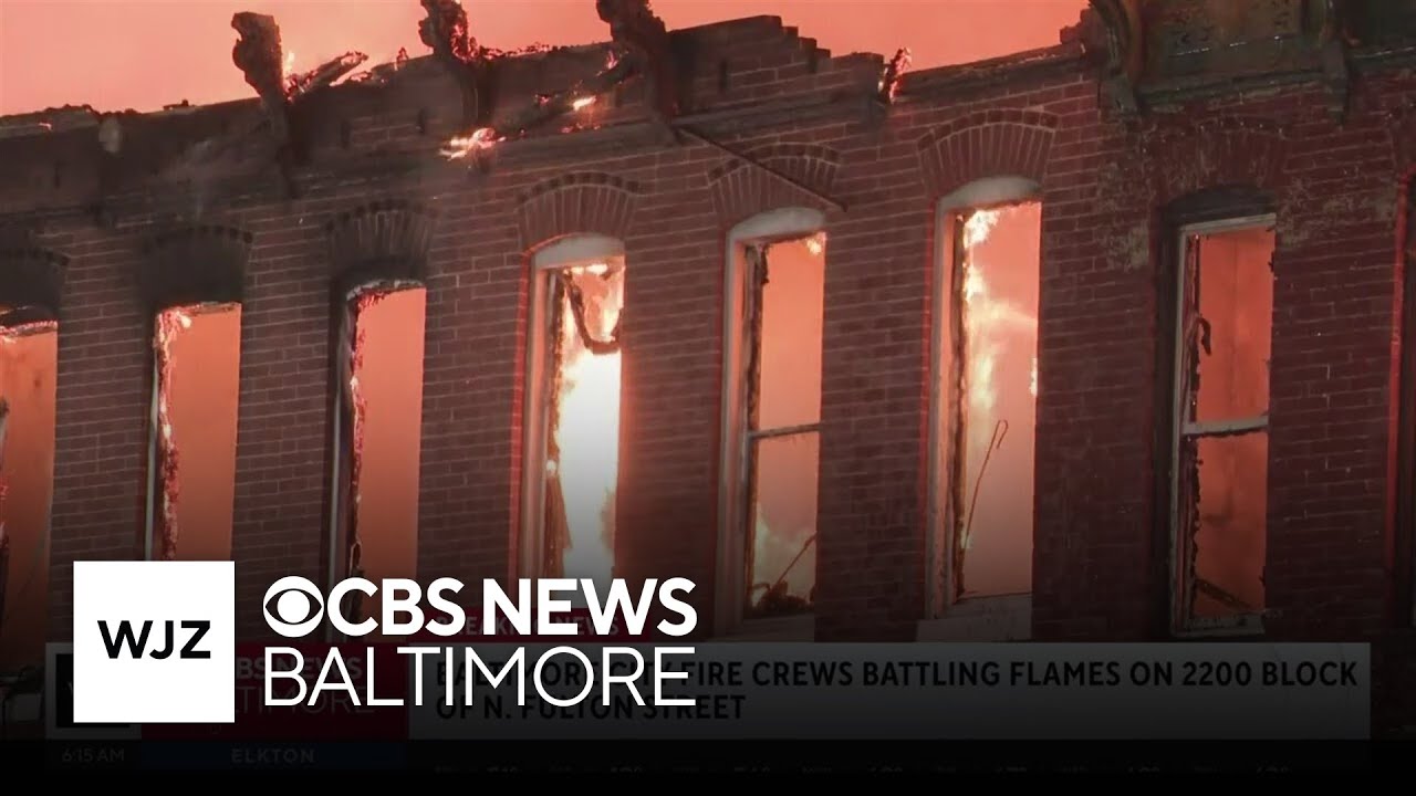 Crews battle fire massive rowhome fire in West Baltimore - YouTube