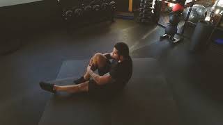 Alternating Tuck Sit Ups