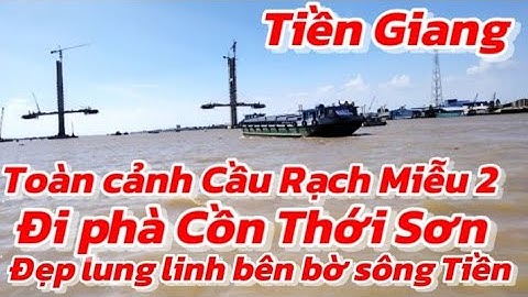 Đi phà Cồn Thới Sơn Toàn cảnh ngắm hai trụ chính dây văng Cầu Rạch Miễu 2 nằm giữa dòng sông Tiền