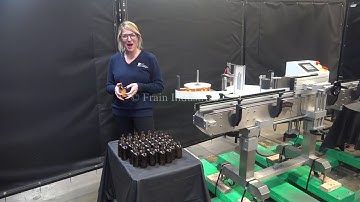 Labelette, automatic, inline, pressure sensitive wrap labeler