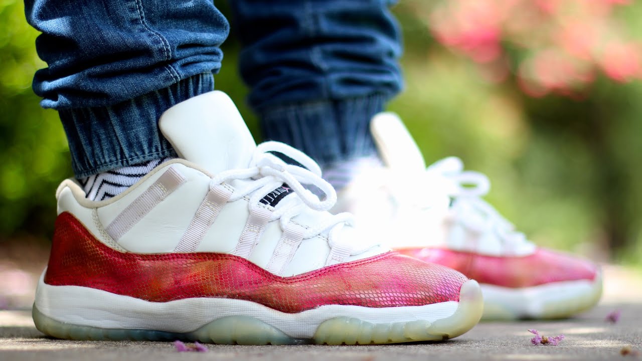 white and pink snakeskin 11s