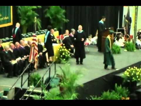Guy Falls Walking in Graduation