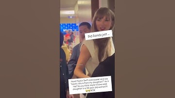 Taylor Swift receiving a friendship bracelet at Bearcats game with Travis Kelce...
