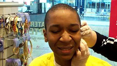 Dorrell getting his earpiercing! lol It got STUCK!...