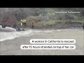 California woman rescued after hours stranded on car