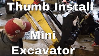 Mini Excavator Thumb Installation on a John Deere 27C.