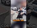 Cop  points gun at unarmed man with scooter and phone.