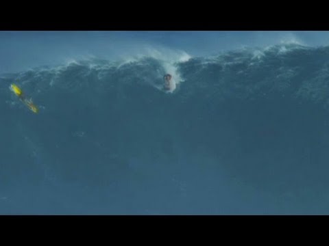 Garrett McNamara catches a record-setting 78-foot wave.