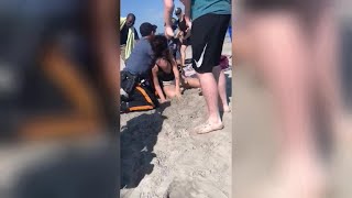 Video shows officer punching woman in the head on New Jersey beach