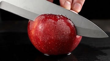 ASMR Video Prompt 3: Hyper Realistic ASMR Macro – Cutting a Frozen Apple Shot: Extreme macro pe...