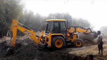JCB Backhoe Loader Digging Foundation For Bridge Construction Across The River