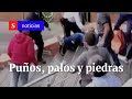 A puños y patadas se enfrentaron rappitenderos y habitantes de Cedritos | Semana Tv