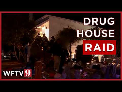 Florida police pull DOZENS of people out of 'drug house' in early morning SWAT operation
