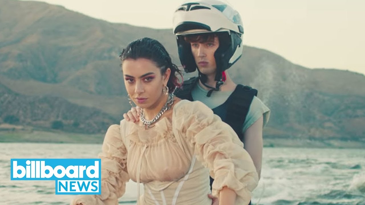 Charli XCX & Troye Sivan Release '2099' Music Video | Billboard News