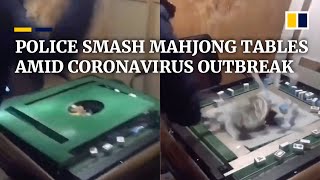Coronavirus: Police in China smash mahjong tables to stop villagers from gathering