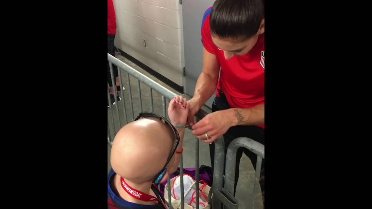 USWNT Goalkeeper Hope Solo surprises honoree Kodi Tutt with a friendship bracelet