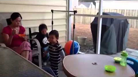 Zander and Aaron playing on porch