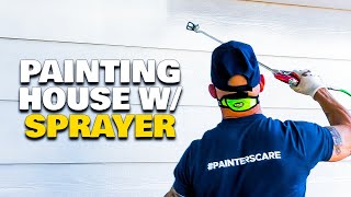 Painting a house with a sprayer.  Painting with an airless sprayer.