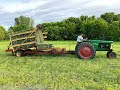 1st crop grass small squares using a John Deere 336 and a New Holland stackliner.