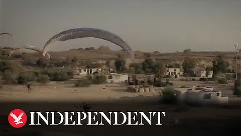 Hamas fighters appear to paraglide across border in released footage