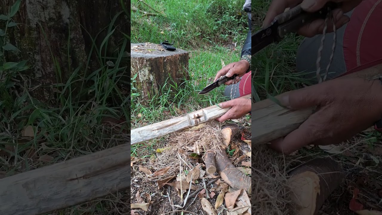 Starting a fire with the fire saw technique in the forest 